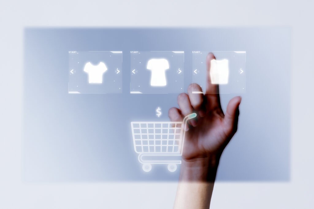 Person adding clothes to cart closeup for online shopping
